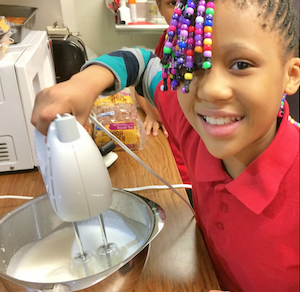 Making whipped cream for will berry puff dessert.